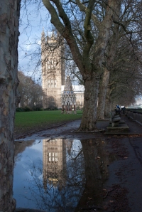 Westminster Abbey reflected in a large puddle after some heavy rain in London.
